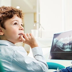 Young child looking at dental X-ray