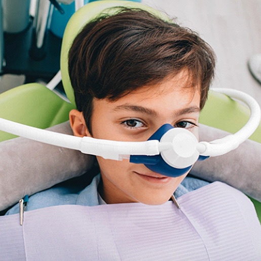 A young boy wears a nose mask in preparation to receive nitrous oxide sedation