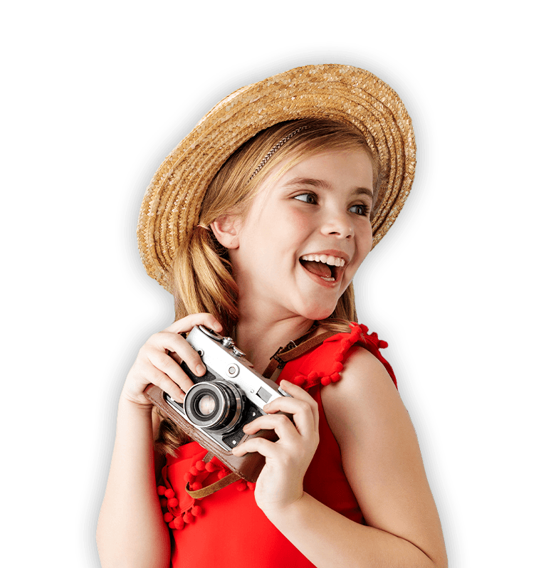 Laughing girl holding a camera