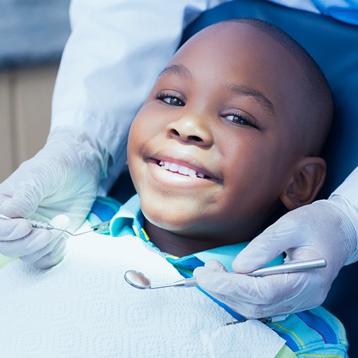 Child smiling at dental checkup