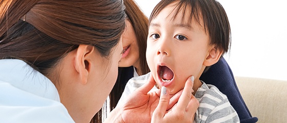Young child receiving dental exam